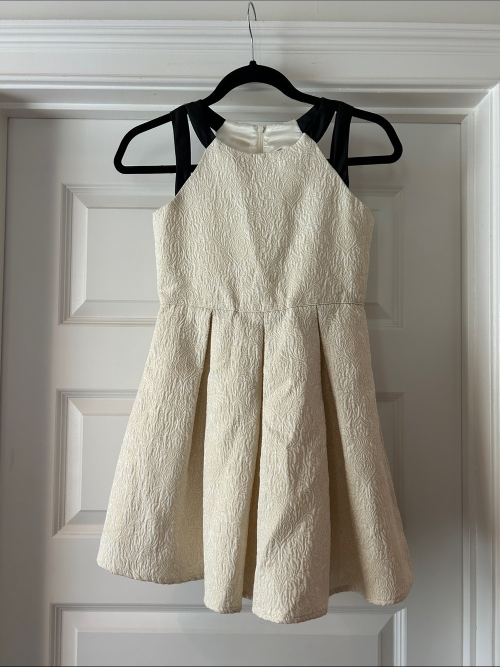 Girls' Cream jacquard fit and flare w/ Black straps, fully lined. Size 10
